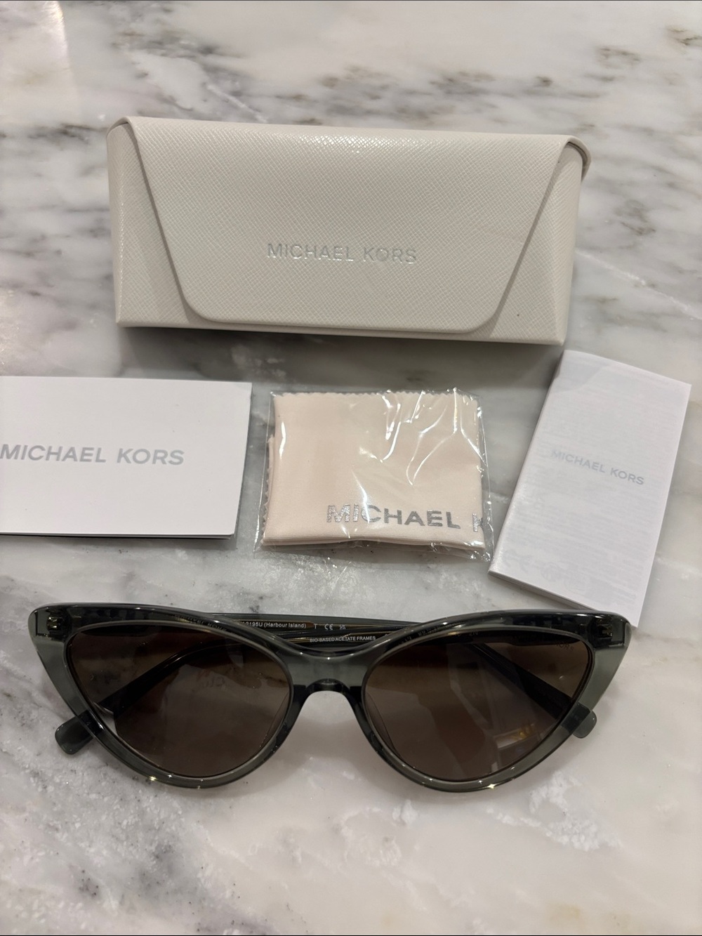 MICHAEL KORS Translucent Gray Cat-Eye Sunglasses with Brown Lenses